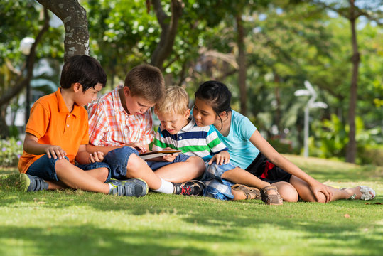 Children with digital tablet