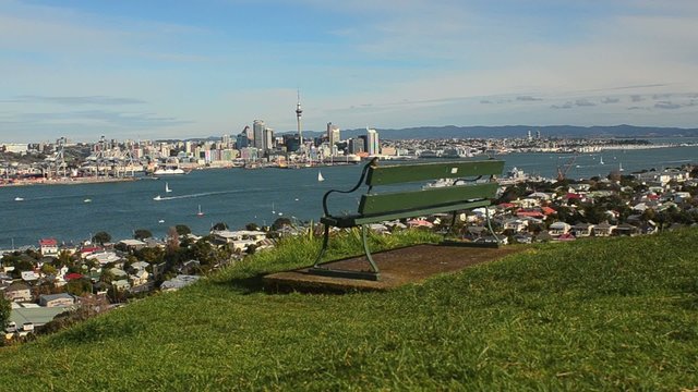 Empty bench facing Auckland skyline view