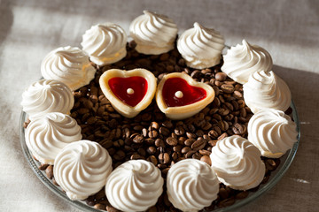French vanilla meringue cookies and two sweet hearts