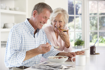 Fototapeta na wymiar Retired couple eating breakfast