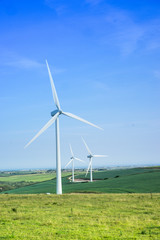 Fototapeta premium Scenic rural landscape with windmills, in summer