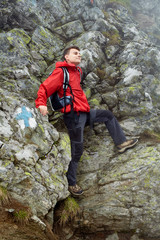 Obraz premium Teenage hiker on mountain