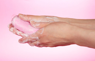 The woman washes hands about the soap