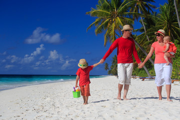 family with kids on tropical beach