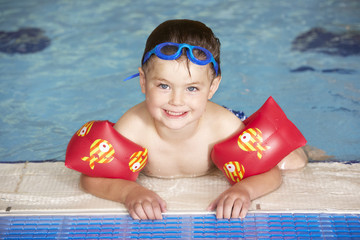 Young boy in swimming pool
