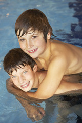 Boy and girl in swimming pool