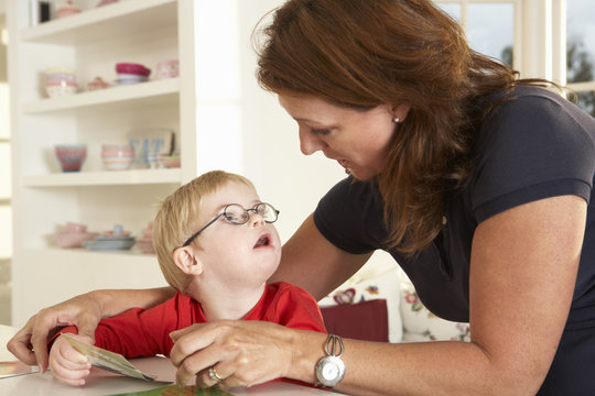 Downs Syndrome boyhaving speech therapy
