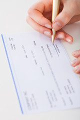 Businesswoman Signing Cheque