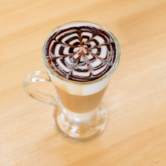 Iced coffee with chocolate sauce on top