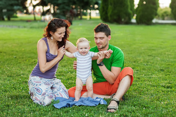 Young Attractive Parents and Child Portrait Outdoors