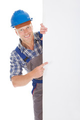 Confident Manual Worker Holding Billboard