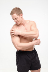 Young sportsman feeling pain