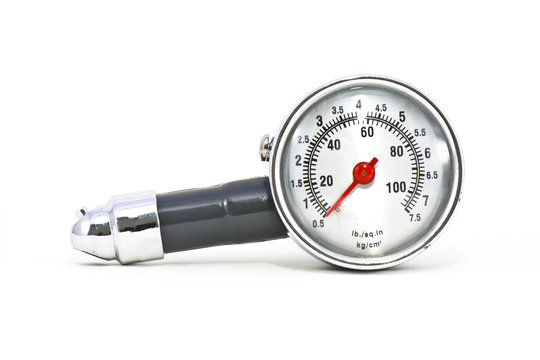 Old Tire gauge on white background