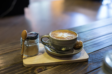 Coffee in cup and cookies in coffee cafe