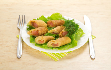 Pancakes with salmon and salad