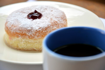 donuts and a cup of black coffee