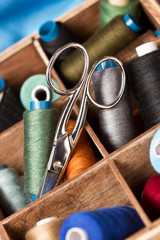Fototapeta na wymiar Sewing thread and scissors