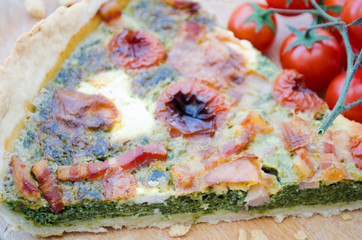 Spinach tart with cheese,bacon and tomatoes.