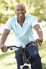 Young  man cycling in park