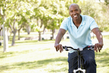 Fototapeta premium Young man cycling in park