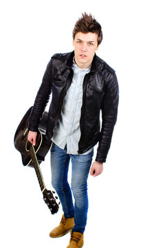 man in a leather jacket with a guitar