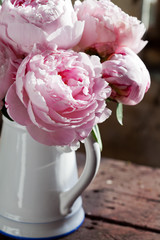 Bouquet of pink peonies in vase