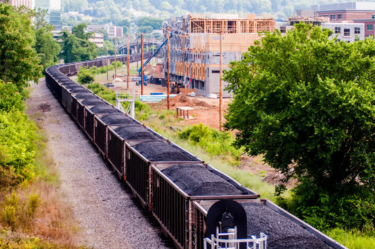 Fototapeta slow moving Coal wagons on railway tracks