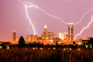 thunderstorm lightning strikes over charlotte city skyline in no