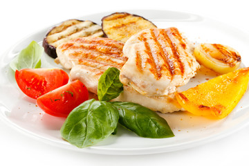 Grilled chicken breasts and vegetables