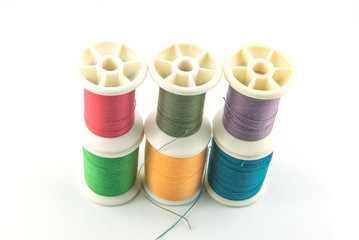 Macro picture of yarn bobbins of different colors