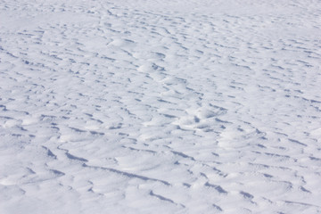 Wavy white snow surface