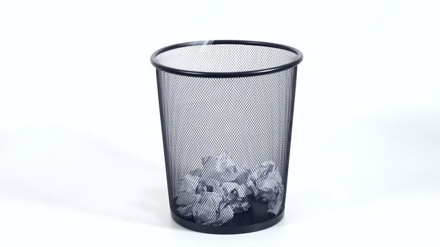 throw papers into metal trash