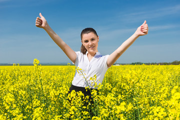 Naklejka na ściany i meble girl in suit at the yellow flower field show best gesture
