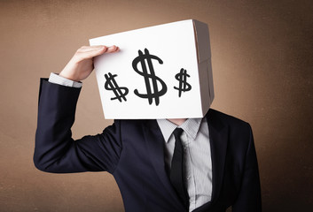 Businessman gesturing with a cardboard box on his head with doll