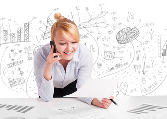 Business woman at desk with hand drawn charts