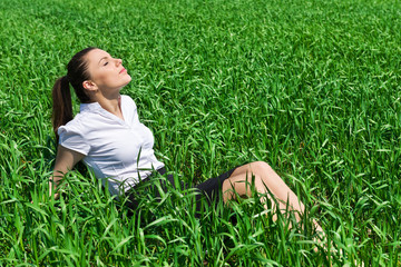 girl relaxing on field