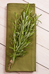 Bunch of rosemary on a rustic wood 