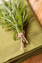 Bunch of rosemary on a rustic wood 