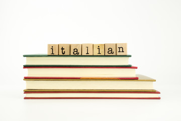 italian language word on wood stamps and books