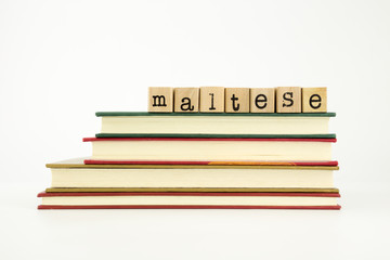 maltese language word on wood stamps and books