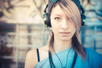 young beautiful model woman listening music