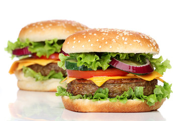 Two delicious hamburgers isolated on white background