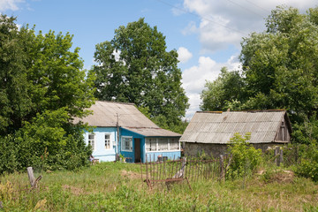 Fototapeta na wymiar Russian village house and barn