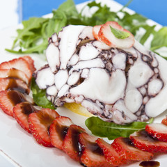 octopus carpaccio with rucola salad and strawberries