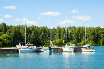 Fototapeta na wymiar Boats and yachts at old pier
