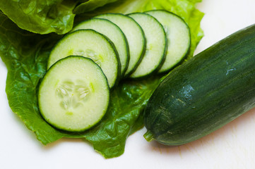 Cucumber slices on a white background