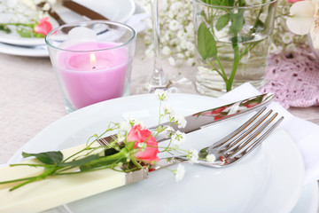 Table setting with spring flowers close up