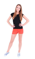 Fototapeta premium Beautiful young girl in shorts and t-shirt isolated on white