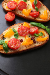 Tasty bruschetta with tomatoes in pan, close up