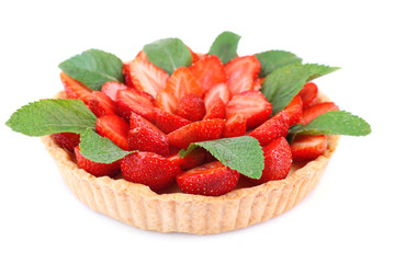 Strawberry tart with green mint leaves isolated on white